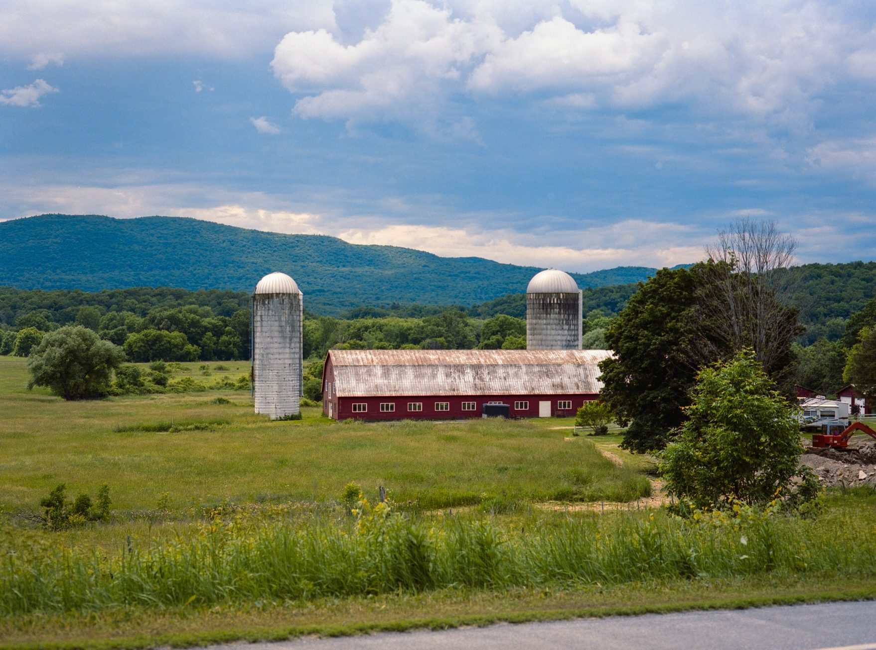 Classic Vermont red barn and Green Mountains
