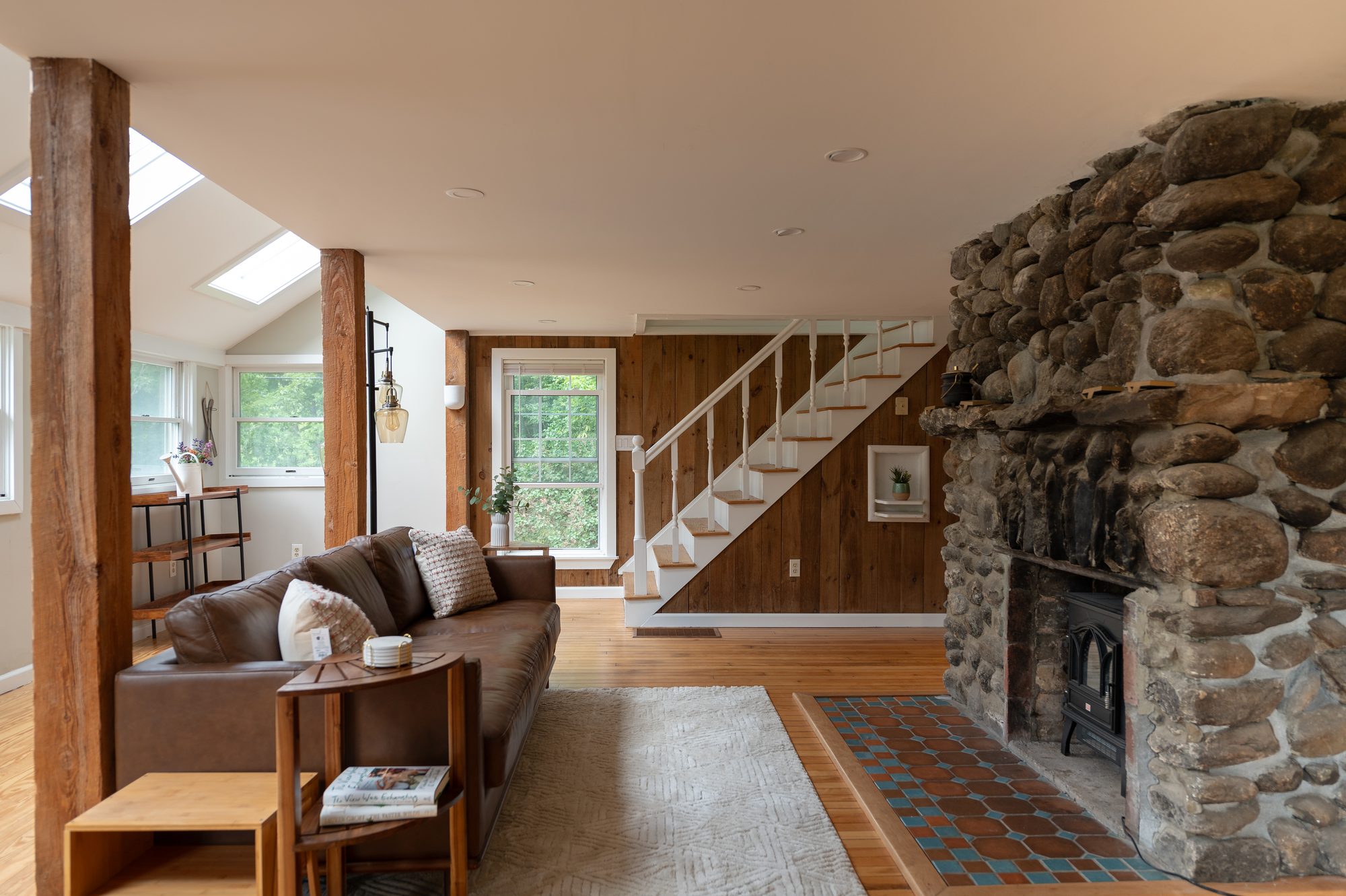 Stone fireplace and open living/dining area